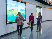 Citizens are cooling off at the platform of Line 4 of the rail transit train in Chongqing, China, on July 13, 2024. (