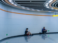 Citizens are cooling off at the platform of Line 4 of the rail transit train in Chongqing, China, on July 13, 2024. (