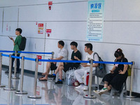 Citizens are cooling off at the platform of Line 4 of the rail transit train in Chongqing, China, on July 13, 2024. (