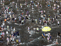 Tourists are enjoying cooling off in the water in Pingnan county, in Fujian, China, on July 13, 2024. (