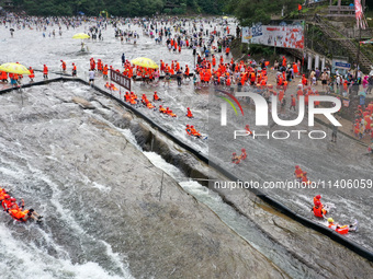 Tourists are enjoying cooling off in the water in Pingnan county, in Fujian, China, on July 13, 2024. (