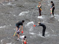 Tourists are enjoying cooling off in the water in Pingnan county, in Fujian, China, on July 13, 2024. (