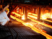 A worker is working at a steel casting workshop of a steel company in Lianyungang, China, on July 13, 2024. (