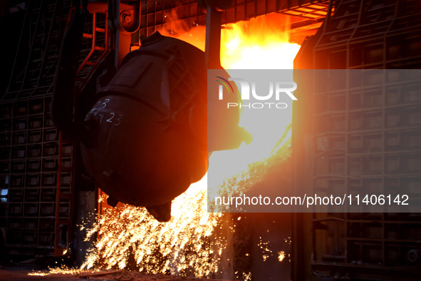 A worker is working at a steel casting workshop of a steel company in Lianyungang, China, on July 13, 2024. 