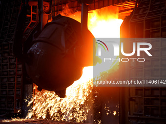 A worker is working at a steel casting workshop of a steel company in Lianyungang, China, on July 13, 2024. (