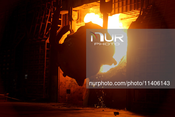 A worker is working at a steel casting workshop of a steel company in Lianyungang, China, on July 13, 2024. 