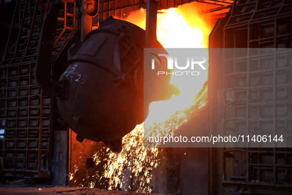 A worker is working at a steel casting workshop of a steel company in Lianyungang, China, on July 13, 2024. 