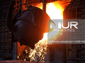 A worker is working at a steel casting workshop of a steel company in Lianyungang, China, on July 13, 2024. (