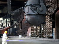 A worker is working at a steel casting workshop of a steel company in Lianyungang, China, on July 13, 2024. (