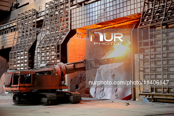 A worker is working at a steel casting workshop of a steel company in Lianyungang, China, on July 13, 2024. 