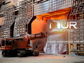 A worker is working at a steel casting workshop of a steel company in Lianyungang, China, on July 13, 2024. (