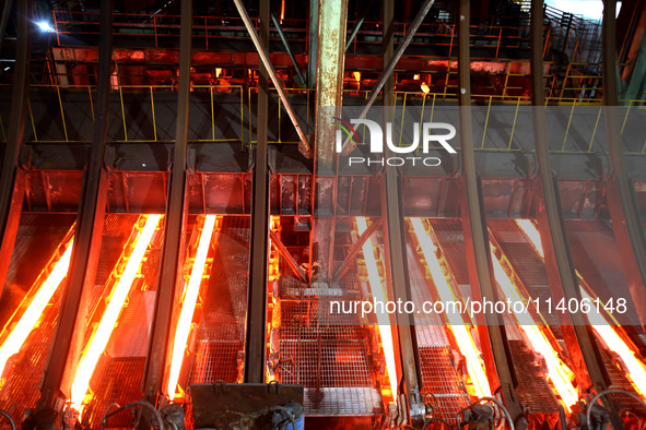 A worker is working at a steel casting workshop of a steel company in Lianyungang, China, on July 13, 2024. 