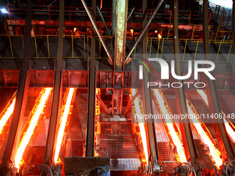 A worker is working at a steel casting workshop of a steel company in Lianyungang, China, on July 13, 2024. (