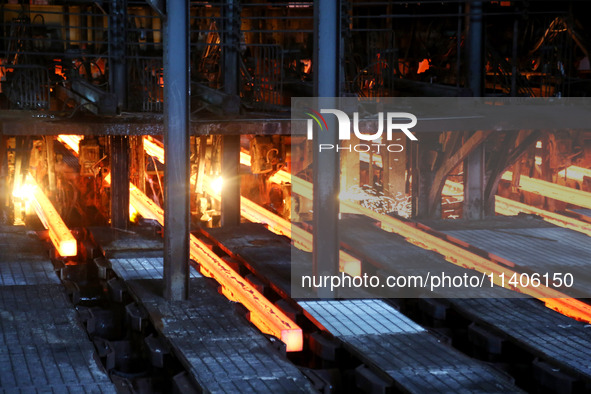 A worker is working at a steel casting workshop of a steel company in Lianyungang, China, on July 13, 2024. 