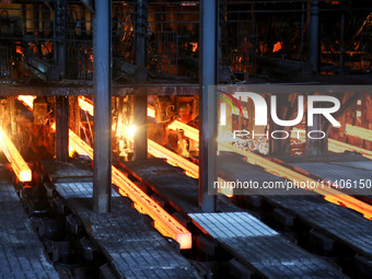 A worker is working at a steel casting workshop of a steel company in Lianyungang, China, on July 13, 2024. (