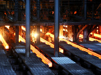 A worker is working at a steel casting workshop of a steel company in Lianyungang, China, on July 13, 2024. (