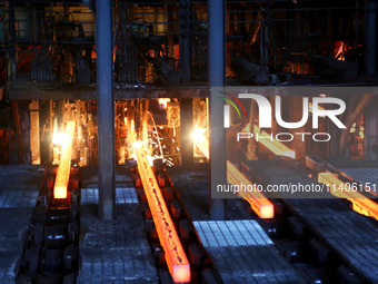 A worker is working at a steel casting workshop of a steel company in Lianyungang, China, on July 13, 2024. (