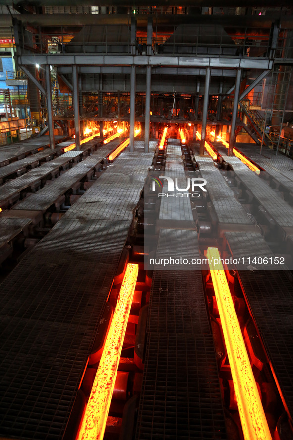 A worker is working at a steel casting workshop of a steel company in Lianyungang, China, on July 13, 2024. 