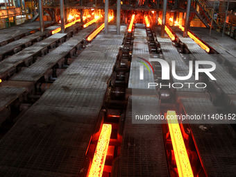 A worker is working at a steel casting workshop of a steel company in Lianyungang, China, on July 13, 2024. (