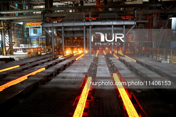 A worker is working at a steel casting workshop of a steel company in Lianyungang, China, on July 13, 2024. 