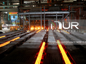 A worker is working at a steel casting workshop of a steel company in Lianyungang, China, on July 13, 2024. (