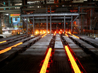 A worker is working at a steel casting workshop of a steel company in Lianyungang, China, on July 13, 2024. (