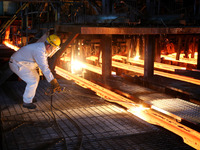 A worker is working at a steel casting workshop of a steel company in Lianyungang, China, on July 13, 2024. (