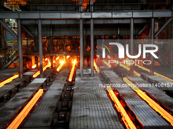 A worker is working at a steel casting workshop of a steel company in Lianyungang, China, on July 13, 2024. (