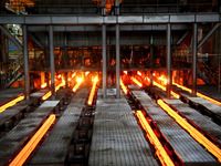 A worker is working at a steel casting workshop of a steel company in Lianyungang, China, on July 13, 2024. (