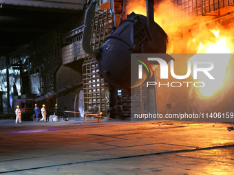 A worker is working at a steel casting workshop of a steel company in Lianyungang, China, on July 13, 2024. (