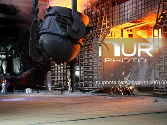 A worker is working at a steel casting workshop of a steel company in Lianyungang, China, on July 13, 2024. (