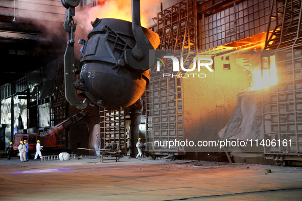 A worker is working at a steel casting workshop of a steel company in Lianyungang, China, on July 13, 2024. 