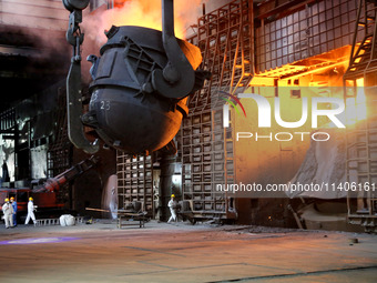 A worker is working at a steel casting workshop of a steel company in Lianyungang, China, on July 13, 2024. (