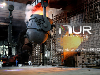 A worker is working at a steel casting workshop of a steel company in Lianyungang, China, on July 13, 2024. (