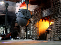 A worker is working at a steel casting workshop of a steel company in Lianyungang, China, on July 13, 2024. (