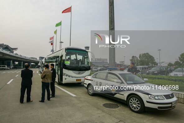 Chinese public security officers are standing by near the airport in Nanjing, China. 