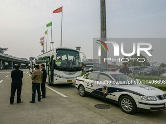 Chinese public security officers are standing by near the airport in Nanjing, China. (