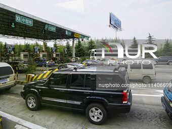 A general view of a highway tollgate is being shown in Nanjing, China. (