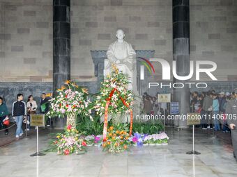 Visitors are worshipping at Sun Zhongshan tombstone in Nanjing, China. (