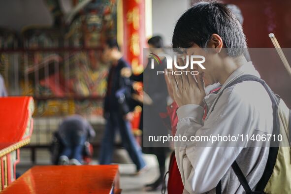 Visitors are praying for their happiness at Lingshan Temple in Wuxi, China. 