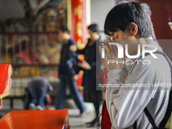 Visitors are praying for their happiness at Lingshan Temple in Wuxi, China. (