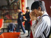 Visitors are praying for their happiness at Lingshan Temple in Wuxi, China. (