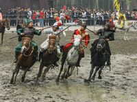 Actors are performing a cavalry battle from the Three Kingdoms era at the CCTV filming location in Wuxi, China. (