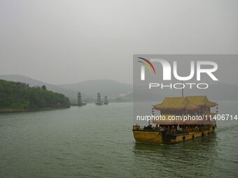 A Chinese traditional ship is sailing on Lake Tai in Wuxi, China. (