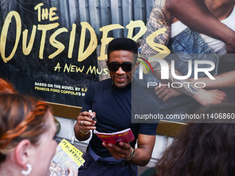 Joshua Boone signing autographs after 'The Outsiders' musical show in Bernard B. Jacobs Theatre on Broadway, New York, United States of Amer...