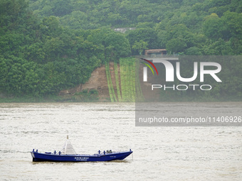 A landslide is occurring near the viewing platform of Mojishan Park on the banks of the Yangtze River in Yichang, Hubei province, China, on...