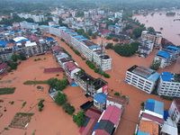 Flood waters are surrounding the field of Tianjia town in Neijiang, China, on July 14, 2024. (