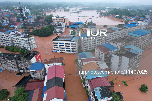 Emergency workers are evacuating stranded people in Neijiang, China, on July 14, 2024. 