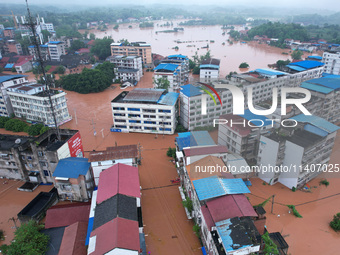 Emergency workers are evacuating stranded people in Neijiang, China, on July 14, 2024. (