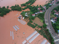 Farmland is flooding along the Xiaoqinglong River at Gaoqiao Street in Neijiang, China, on July 14, 2024. (